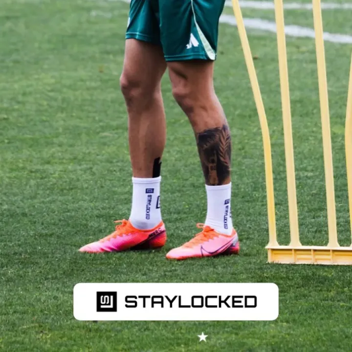Player in StayLocked grip socks and boots during training